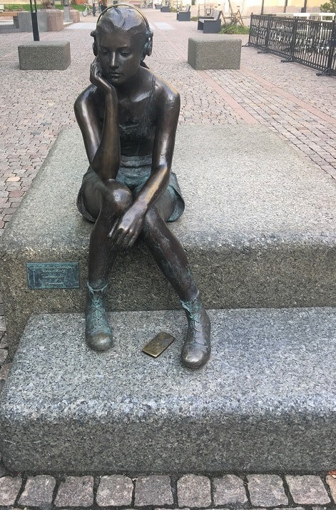 Oslo - Girl Sitting on the Steps with phone