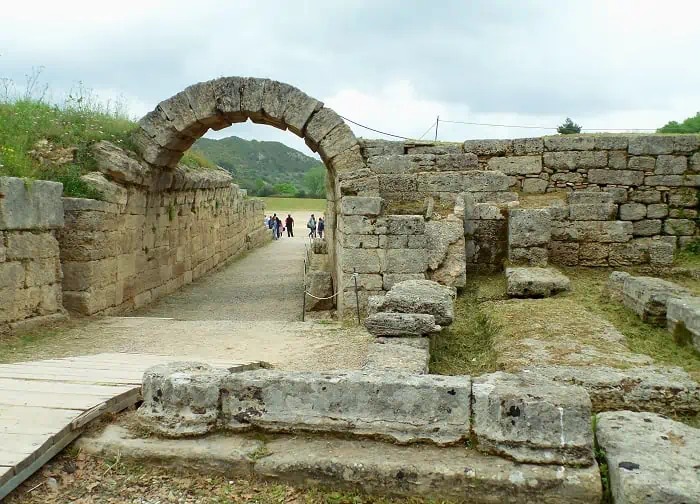 The stone archway leading to the historic stadium of the Ancient Olympia, archaeological site in Peloponnese, Greece