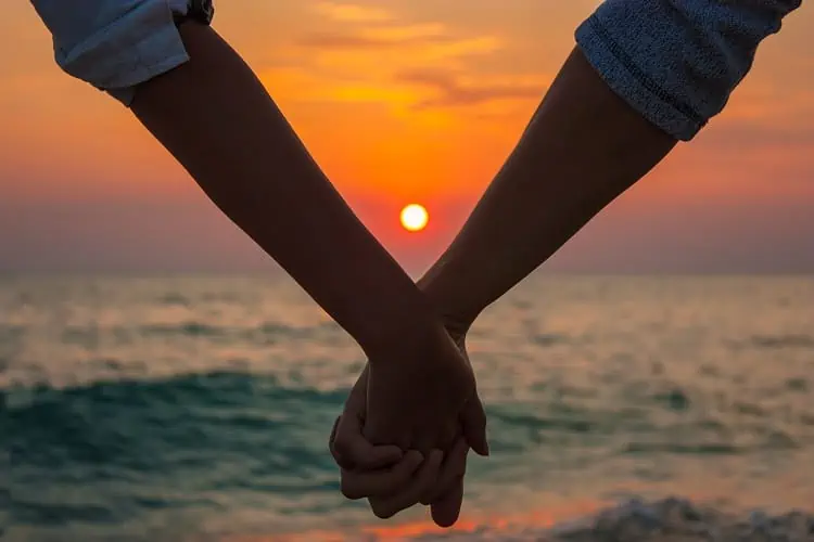 Must Do's for a perfect romantic getaway - Holding Hands on the Beach