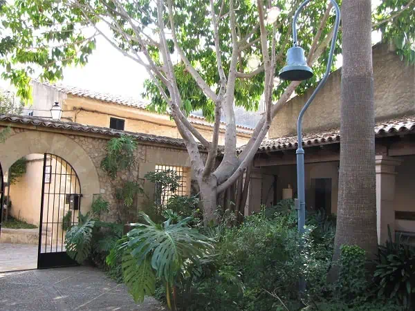 Entrance of the Junipero Serra Museum - Garden with Mission Bell