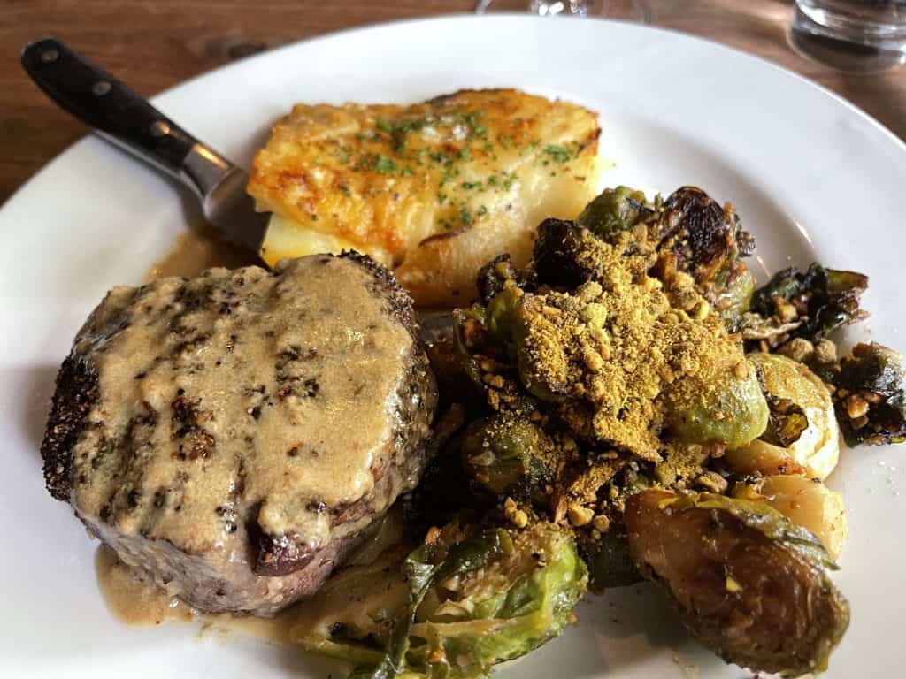 Steak au Poivre with scalloped potatoes and Brussel sprouts