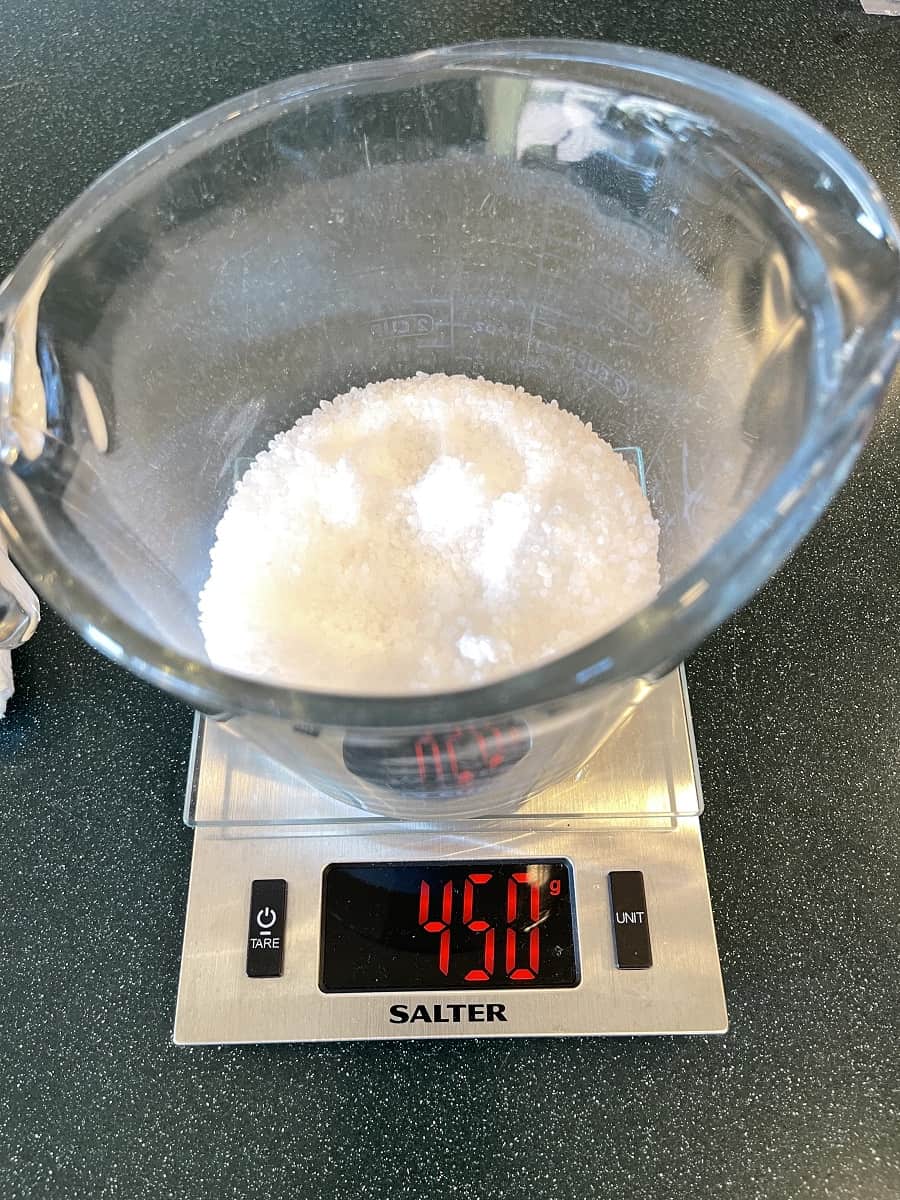 Kosher Salt In Measuring Bowl On Scale Showing Weight