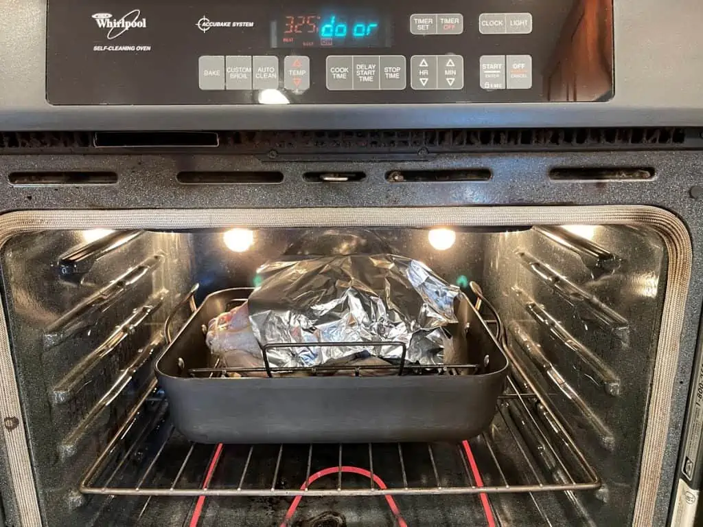 Turkey Covered with Aluminum Foil In Oven