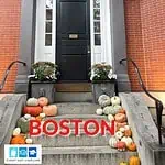 The door to a historic townhouse in Bunker Hill Boston with pumpkins on the steps