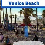 Venice Beach Boardwalk with People walking on the Sandy Beach