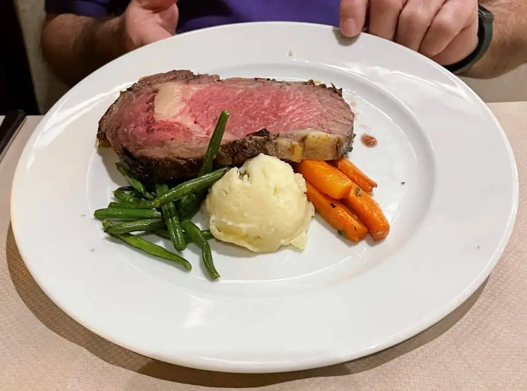 Is Food Free On A Cruise - Prime Rib Dinner with mashed potatoes, carrots and green beans in the Main Dining Room