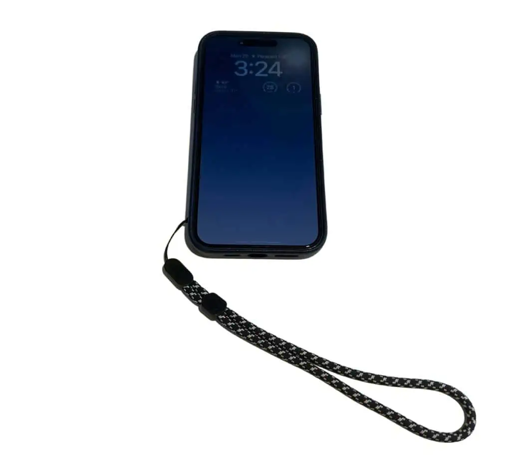 Phone with wrist lanyard attached.