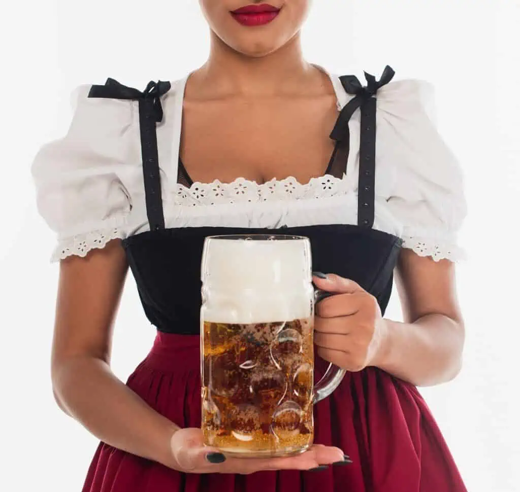 Woman in dirndl holding a stein of beer