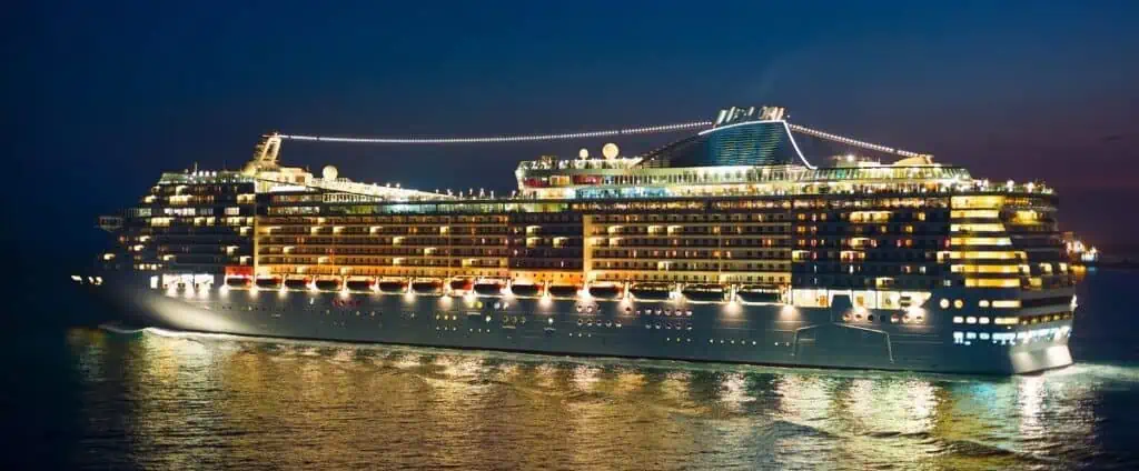 A Cruise Ship Sailing at Night with all her lights on. Port or Starboard
