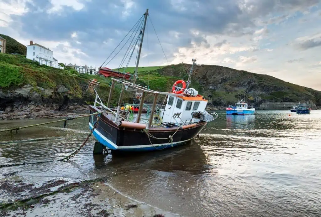 Boat In The Harbor of Port Isaac as the Tide Is going out.