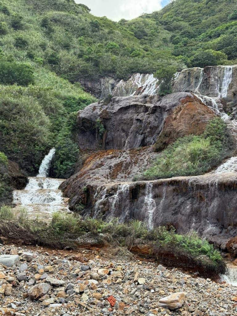 6 Day Taipei & Northern Taiwan Itinerary: Sun Moon Lake, Shifen & Taipei 101 31 A waterfall in the mountain, the rocks stained red from the iron ore