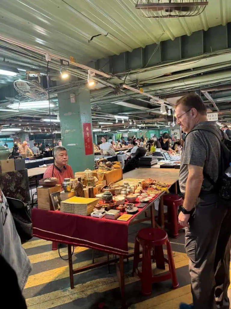6 Day Taipei & Northern Taiwan Itinerary: Sun Moon Lake, Shifen & Taipei 101 9 The author's husband is looking at pottery in the Jade Market