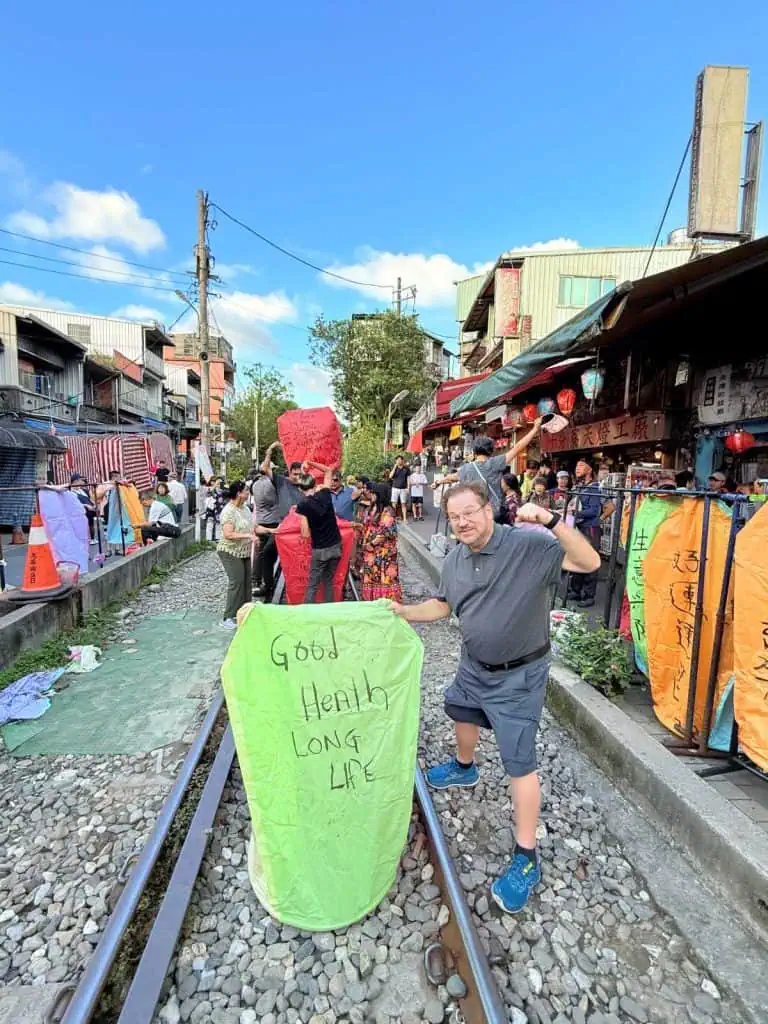 6 Day Taipei & Northern Taiwan Itinerary: Sun Moon Lake, Shifen & Taipei 101 36 The author's husband launches one of his lanterns.