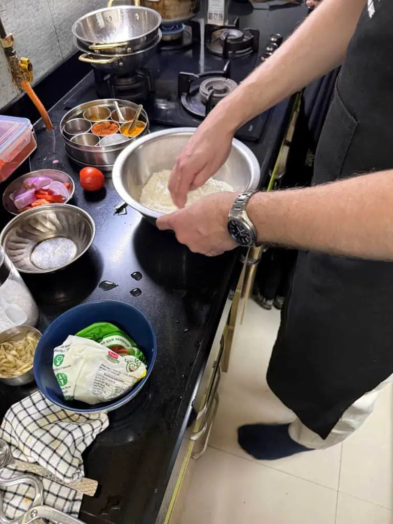 2 Days in Mumbai Before a Cruise: Markets, Street Life, Food, and Local Culture 26 One of the party in the kitchen mixing the ingredients for the naan