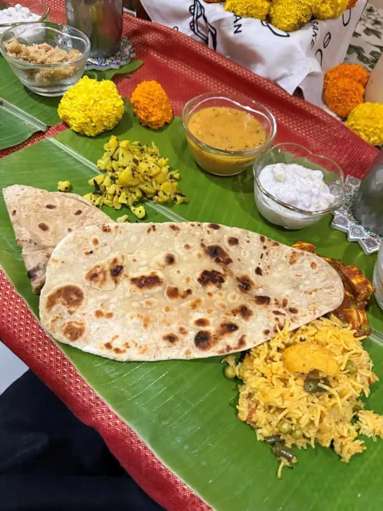 2 Days in Mumbai Before a Cruise: Markets, Street Life, Food, and Local Culture 29 The beautiful table setting with all the side dishes placed on individual banana leaves