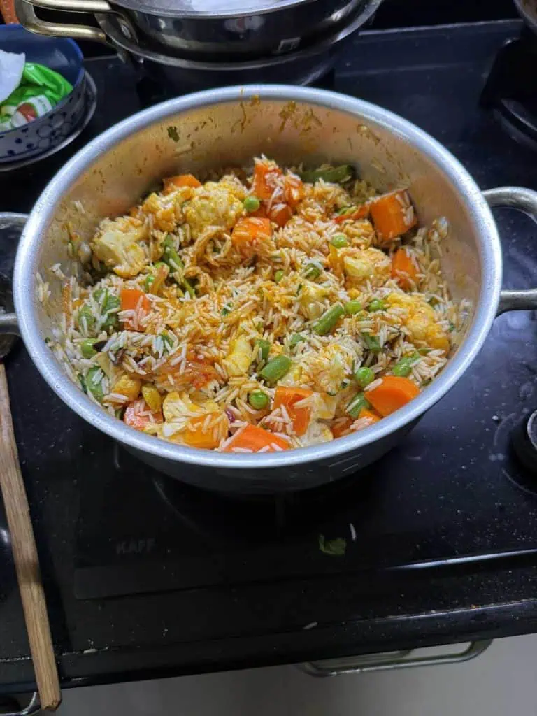 2 Days in Mumbai Before a Cruise: Markets, Street Life, Food, and Local Culture 27 The final pot of curried rice and vegetables including carrots and green beans.