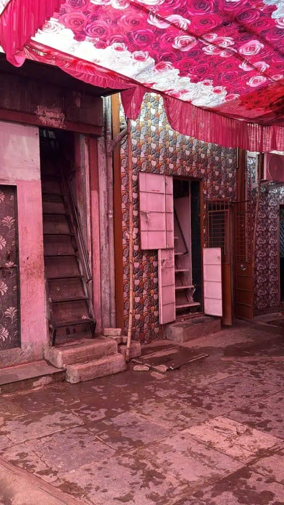 2 Days in Mumbai Before a Cruise: Markets, Street Life, Food, and Local Culture 3 The entrance to a home and business all decorated in Pink in the Dharavi Slum in Mumbai