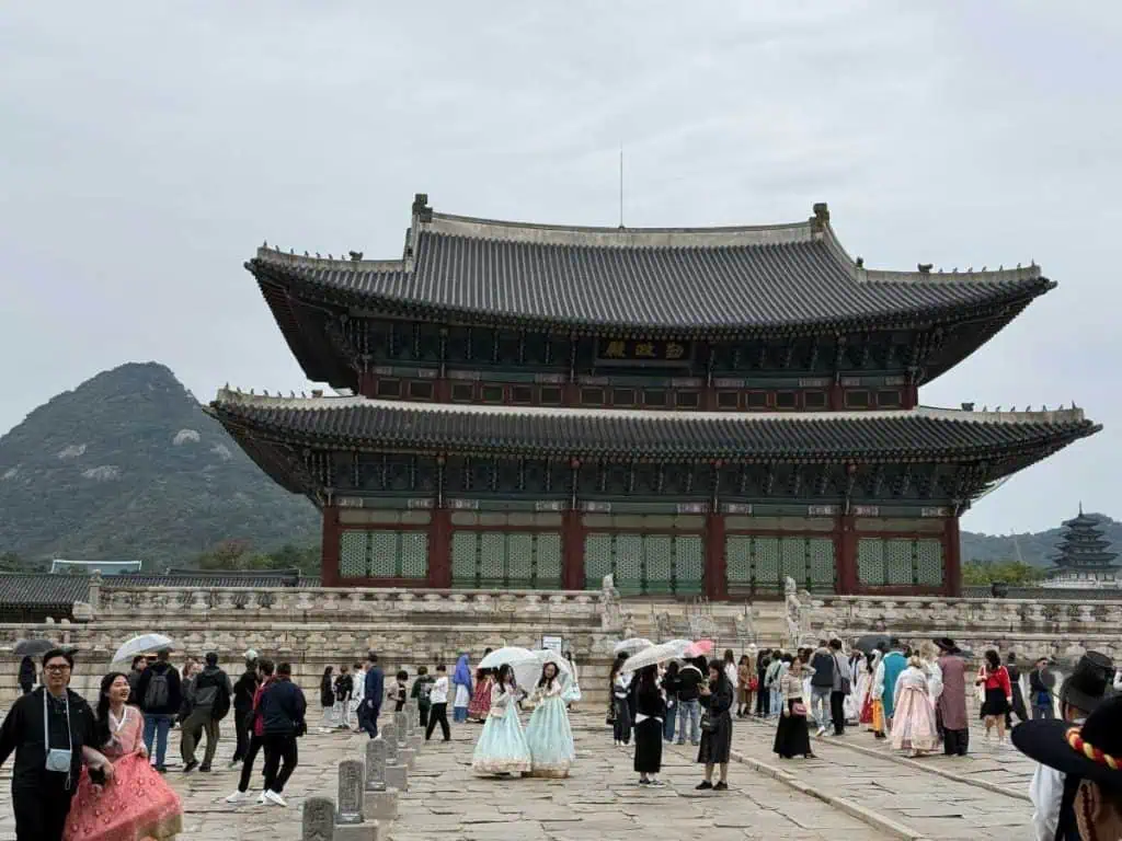 6 Days in Seoul: Royal Palaces, Korean BBQ, Hanbok, and the Unforgettable DMZ 4 6 days in Seoul - The main building at Gyeongbokgung Palace Many people in regular dress and hanbok walking about