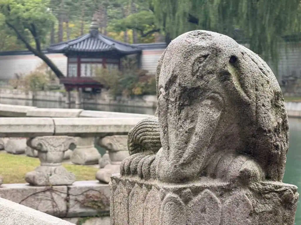 6 Days in Seoul: Royal Palaces, Korean BBQ, Hanbok, and the Unforgettable DMZ 3 A statue of a baby elephant in front of a pond with a gazebo in the background
