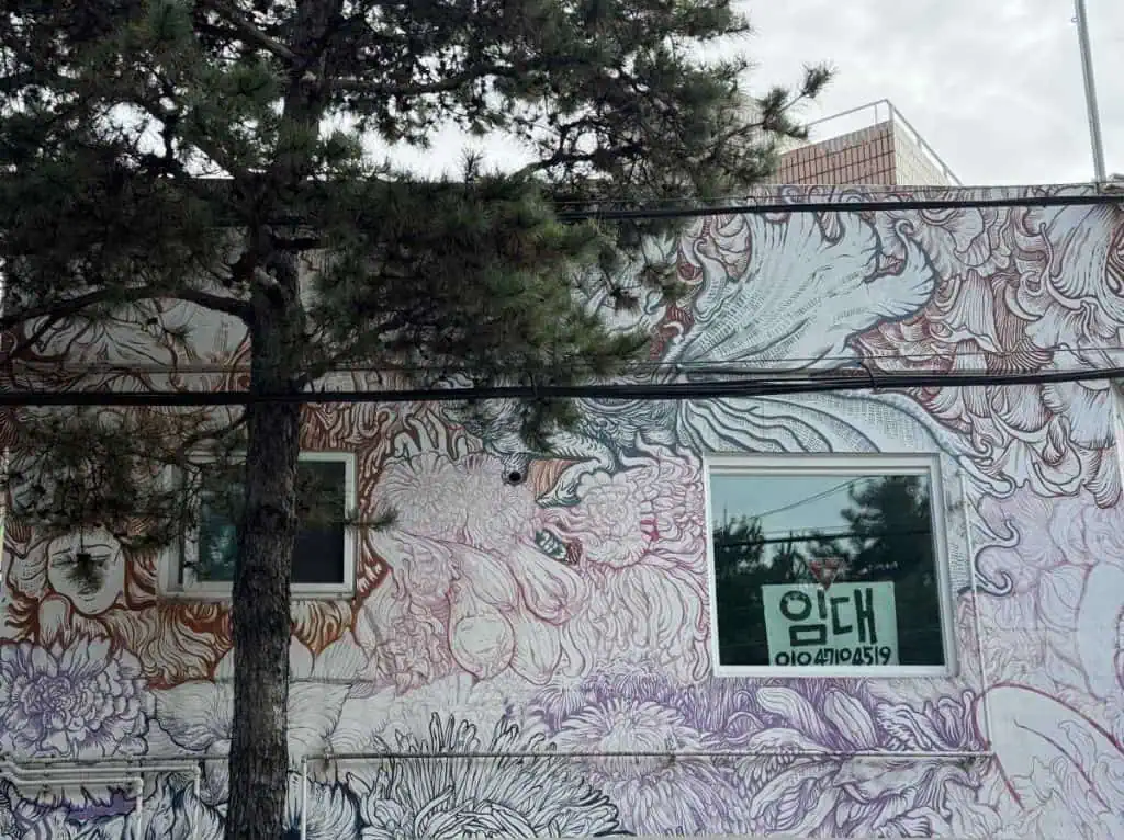 6 Days in Seoul: Royal Palaces, Korean BBQ, Hanbok, and the Unforgettable DMZ 38 A mural in shades of purple on a building in Suwon, S. Korea