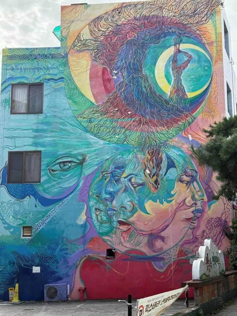 6 Days in Seoul: Royal Palaces, Korean BBQ, Hanbok, and the Unforgettable DMZ 39 A colorful mural depicting a person sleeping with their dreamscape above.